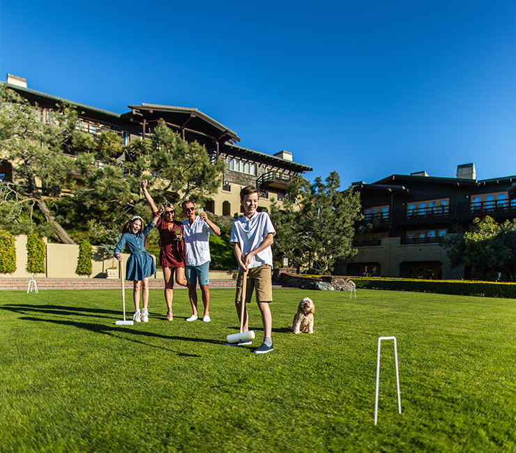 Family playing a match of croquet on the Arroyo Terrace