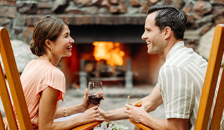 Romantic Couple sharing enjoying a drink at The Grill