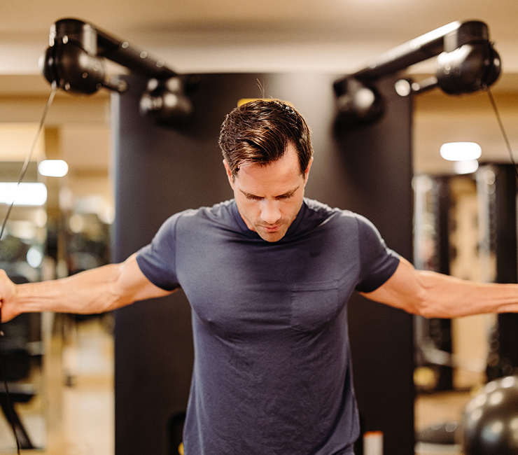 guest working out at the fitness center at The Lodge at Torrey Pines